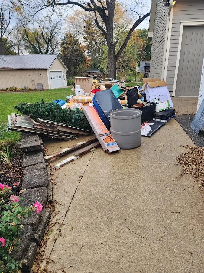 Dumpster being loaded with debris for 30 Yard Dumpster Rental in Carmel